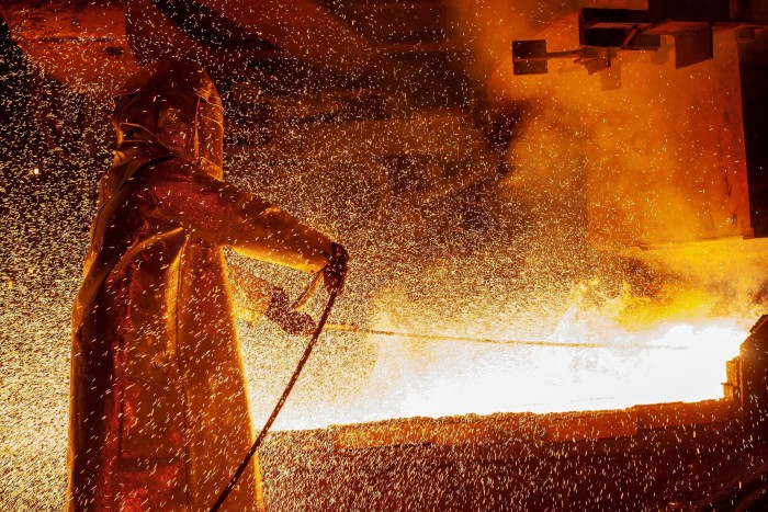 A worker at a nickel smelting furnace in South Sulawesi, Indonesia