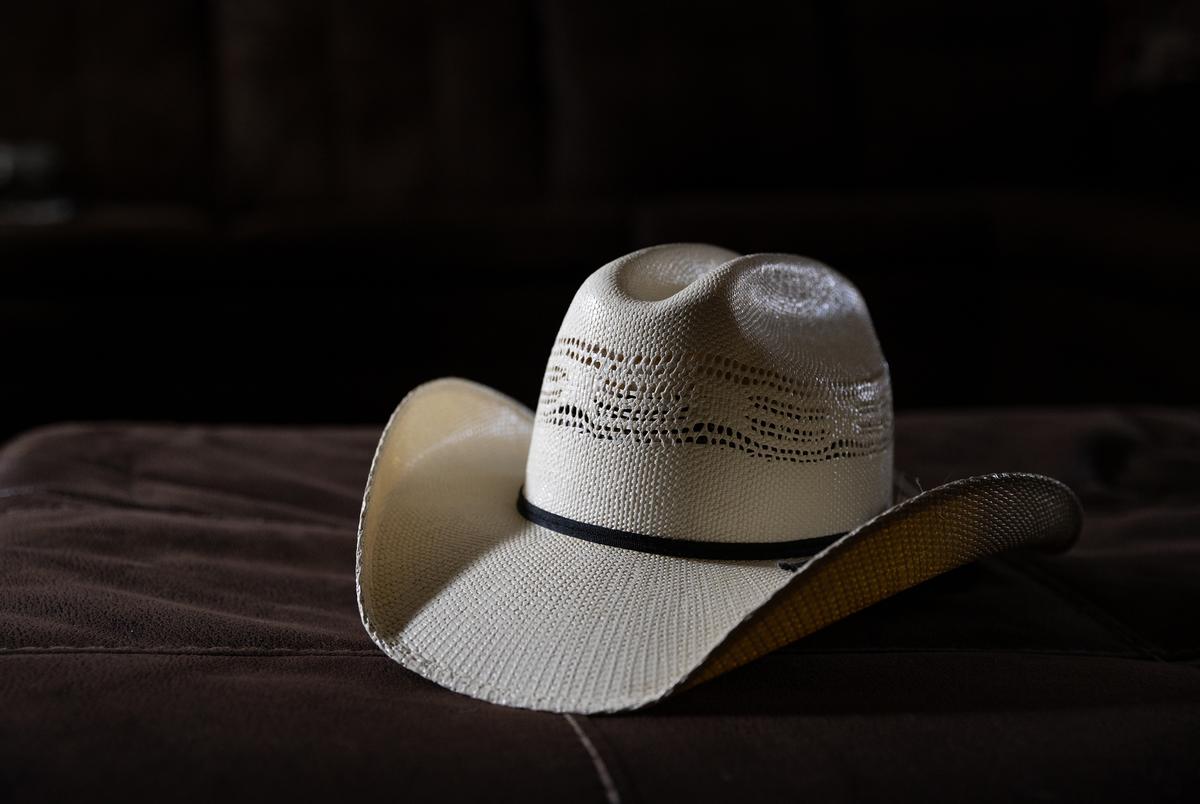 Mike’s cowboy hat is seen in the living room where he passed away. “He’s from that generation where no news is good news,” says his son Rodney, after explaining that since he didn’t hear about his biopsy results Mike thought he was being treated for a UTI.