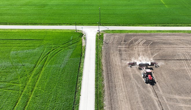 Planting season has begun for Ohio farmers, including Jon Miller of Fairfield County. Miller is seen in this aerial photo taken Monday, April 22,2024, moving his tractor and soybean planter near the intersection of Cattail Road NE and Wollard Road NE.