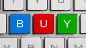 BUY spelled out on a computer keyboard representing stocks to buy