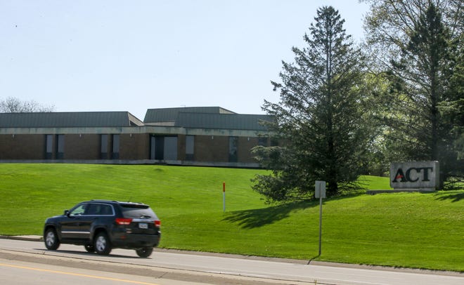 A car drives past ACT’s facility Thursday, April 25, 2024 in Iowa City, Iowa.