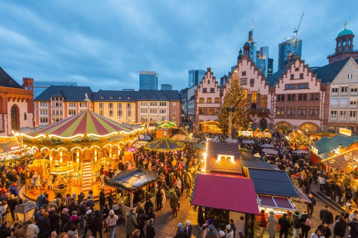 An aerial shot of Frankfurt’s Christmas market on a historic square at night