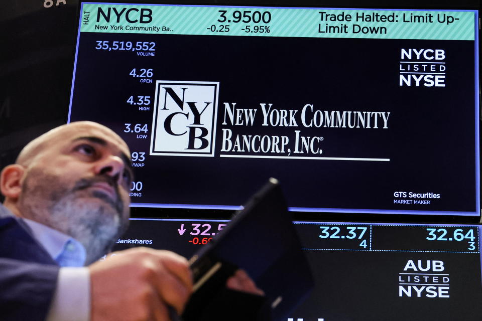 A trader works at the post where New York Community Bancorp stock is traded on the floor at the New York Stock Exchange (NYSE) in New York City, U.S., February 7, 2024.  REUTERS/Brendan McDermid